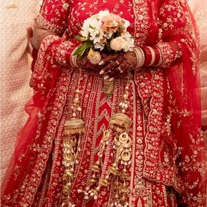Luxurious Red Bridal Dress with Gold Embellishments